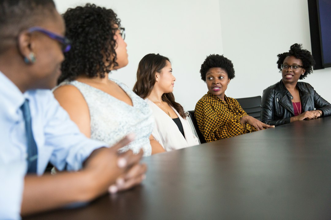 Diverse professionals sitting together and talking